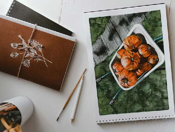 Illustration à l'aquarelle de citrouilles réalisée lors d'un atelier créatif sur le thème de l'automne.