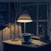 Illustration d'un bureau sur lequel est posé une tasse ainsi qu'une lampe qui éclaire la pièce.